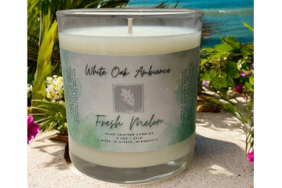 Fresh Melon Scented Candle with a label on a white background – a cozy candle from White Oak Ambience made with clean scented wax