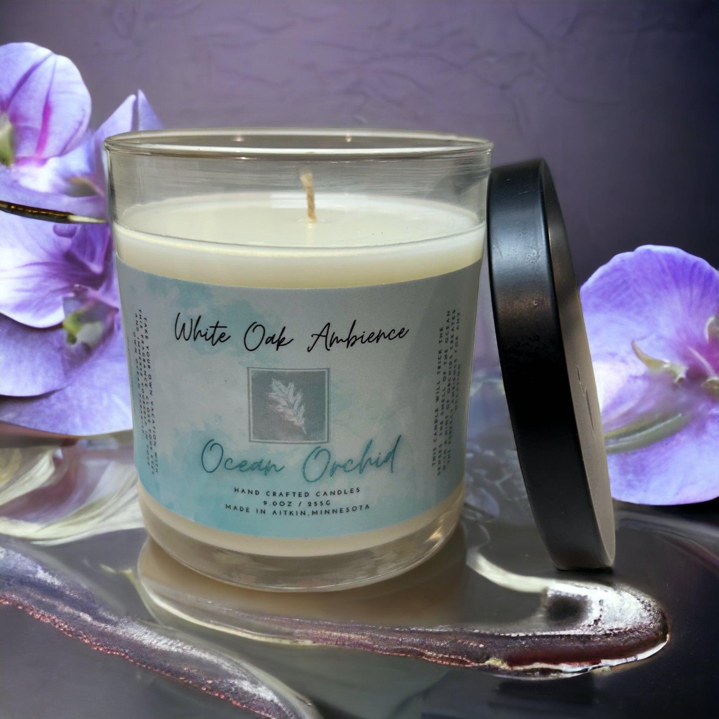 White Oak Ambience Ocean Orchid soy candle displayed on a simple neutral background.