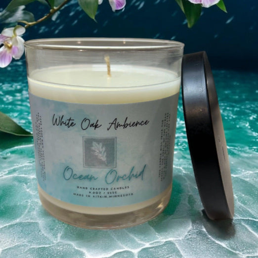 White Oak Ambience Ocean Orchid soy candle displayed on a simple neutral background.