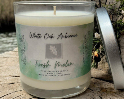 Fresh Melon Scented Candle with a label on a white background – a cozy candle from White Oak Ambience made with clean scented wax
