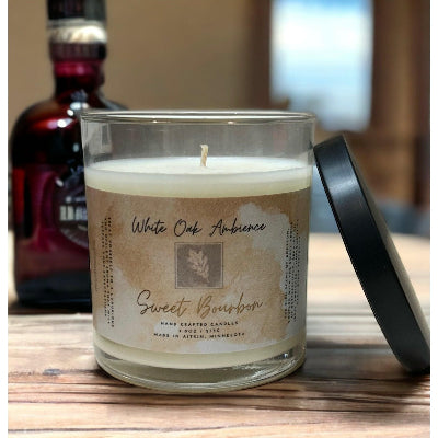 Sweet Bourbon Scented Candle in a glass jar with a label on a white background – a cozy candle from White Oak Ambience made with premium scented wax