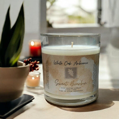 Sweet Bourbon Scented Candle in a glass jar with a label on a white background – a cozy candle from White Oak Ambience made with premium scented wax