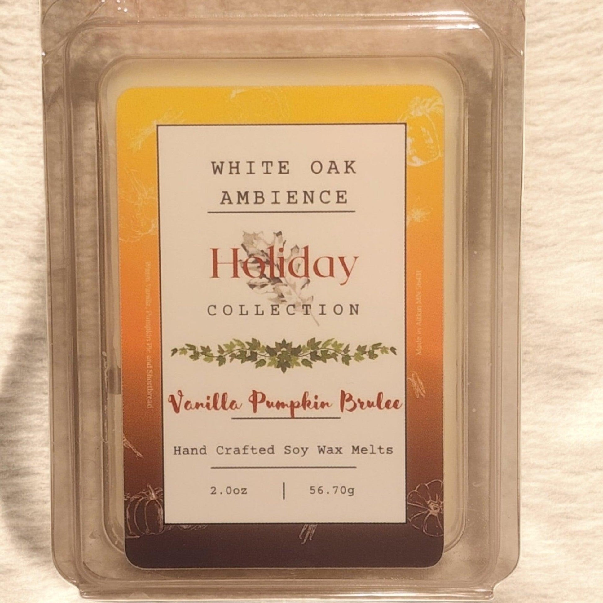 Vanilla Pumpkin Brulee wax melt packaging with 'White Oak Ambience' branding on a wooden surface.