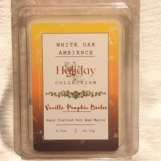 Vanilla Pumpkin Brulee wax melt packaging with 'White Oak Ambience' branding on a wooden surface.